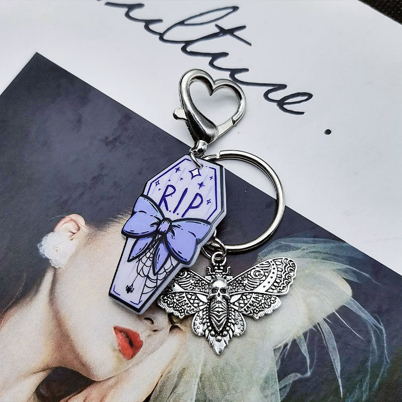 Keyquins de ataúd de mariposa de calavera de estilo retro de estilo retro al por mayor